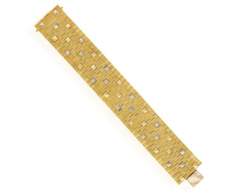 A COLLECTIBLE AND FINE GOLD BRACELET, BY HERMÈS, CIRCA 1965The highly articulated gold strap with brushed square links highli