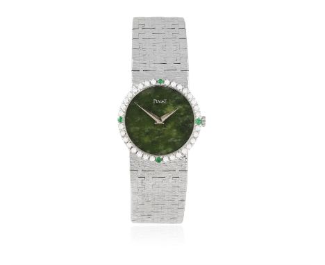 AN ELEGANT 18K GOLD, DIAMOND AND EMERALD-SET BRACELET WATCH WITH JADE DIAL, BY PIAGET, CIRCA 1970The 18-jewel Cal-9P manual w