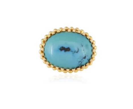 A TURQUOISE DRESS RING, ITALIAN, CIRCA 1960The oval-shaped cabochon turquoise at the centre within a multiple claw-setting an