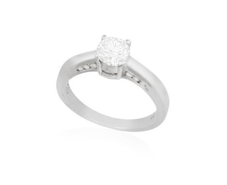 A DIAMOND SINGLE-STONE RINGThe round brilliant-cut diamond weighing 0.59ct within a four-claw setting, accented with similarl