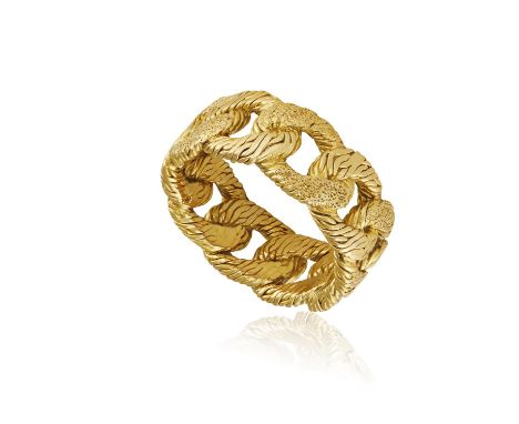 A GOLD DRESS RING, FRENCH, CIRCA 1970* This lot is sold without a reserveComposed of a textured curb-link hoop, in 18K gold, 