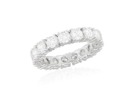 A DIAMOND ETERNITY RINGComposed of a continuous row of brilliant-cut diamonds within claw-setting, mounted in 18K gold, diamo