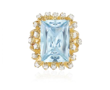 AN AQUAMARINE AND DIAMOND COCKTAIL RING, CIRCA 1960The rectangular mixed-cut aquamarine weighing approximately 15.00cts, high
