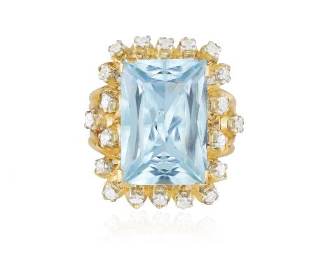 AN AQUAMARINE AND DIAMOND COCKTAIL RING, CIRCA 1960The rectangular mixed-cut aquamarine weighing approximately 15.00cts, high