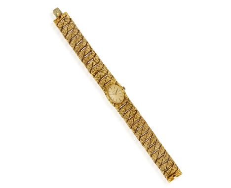 AN 18K GOLD WATCH, BY GEORGES LENFANT AND GUBELIN, CIRCA 1970Of  quartz movement, the oval champagne dial with black applied 
