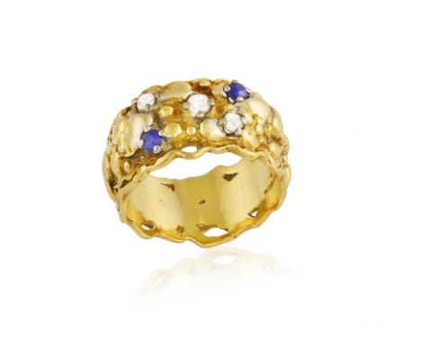 A SAPPHIRE AND DIAMOND RING, BY CHARLES DE TEMPLE, 1979The textured gold hoop with two circular-cut sapphire and three brilli