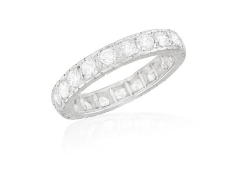 A DIAMOND ETERNITY RINGThe continuous row of brilliant-cut diamonds, mounted in 18K gold, diamonds approximately 1.80ct total