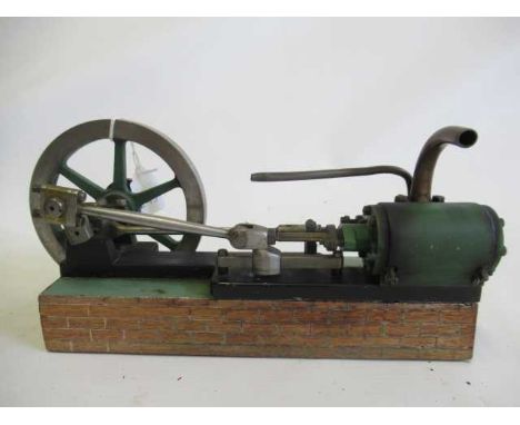 A well made horizontal mill engine, single cylinder, non-reversing, on wooden base, 1 1/4" cylinder with 5" fly wheel (Est. p