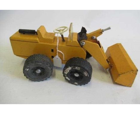 A Steiff wood and metal yellow digger, rubber tyres with operating steering and shovel, F-G (Est. plus 24% premium inc. VAT)