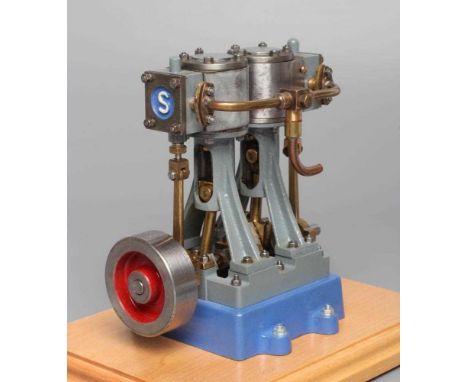 Stuart Turner V10 non-reversing twin cylinder vertical steam engine finished in grey and blue on wooden base, free running, w
