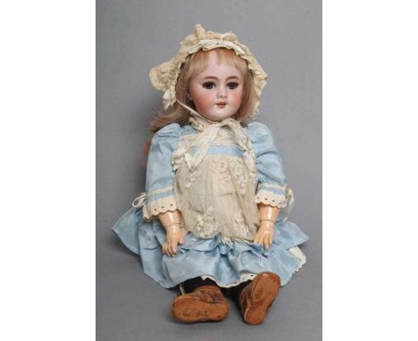 A Tete Jumeau bisque socket head doll, with blue glass sleeping eyes, open mouth, moulded teeth, pierced ears, blond wig, woo