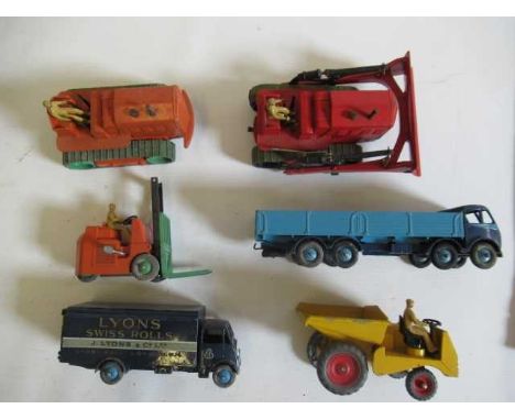 Six Dinky toy vehicles comprising 501 Foden wagon, 514 Guy van "Lyons", 561 Bull Dozer, 662 Dumper Truck, 563 Heavy Tractor a