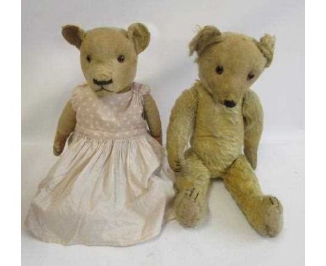 Two English mid-war teddy bears, including a 21" Chad Valley bear in a pink dress and a 24" bear with long blond plush (Est. 