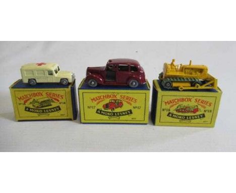 Matchbox 14a Daimler ambulance 49mm, box M, model M, 17c Austin taxi, box M, model M, and 18b Caterpillar bulldozer 50mm, box