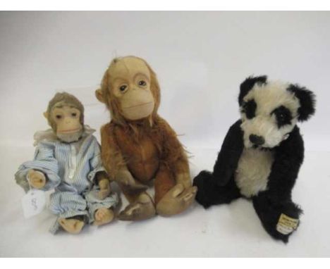 Three vintage plush toys, comprising a 12" Merrythought panda, an 11 1/2" Schuco orangutang with mechanical tail driven head 