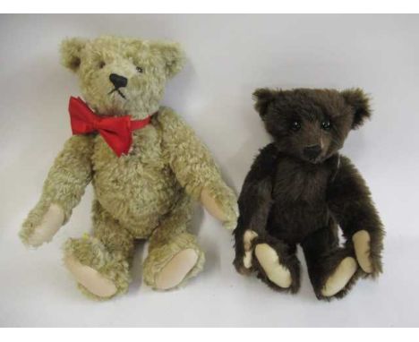 Two Steiff bears, comprising a 13 1/2" classic shaped growling brown bear with brass ear button and a 16" classic shaped grow