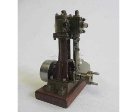 A single cylinder non-reversing vertical steam engine with maker's plate Morss London to cylinder, fabricated construction wi