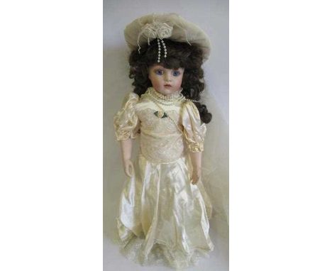Six collectors dolls, all with ceramic heads, makers such as Titus Tomescu and others, largest 25" long (Est. plus 24% premiu