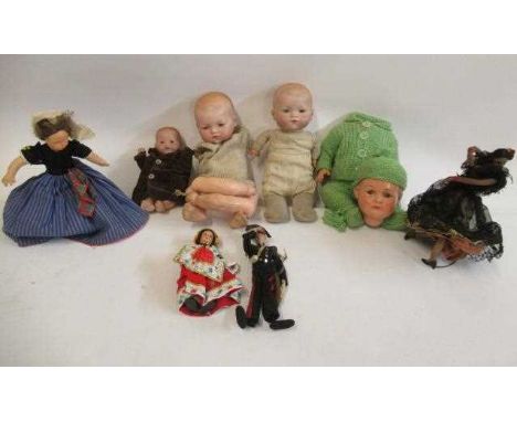 A collection of dolls, including three Armand Marseille bisque head baby dolls, all with sleeping eyes and two with closed mo