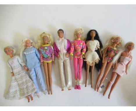 Six Barbies, a Ken doll and a Disney Pocahontas, all in original clothing, one Barbie with cloth body and celluloid hands mar
