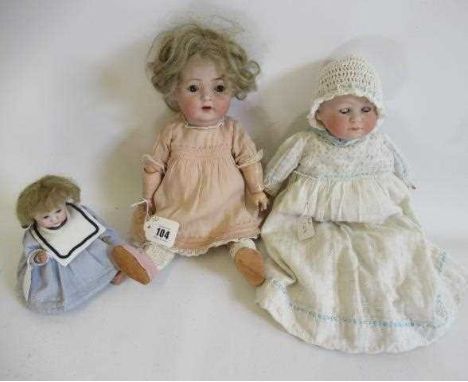 Three German bisque head dolls, comprising a 14 1/2" 121 K&amp;R Simon Halbig bisque socket head doll with wood and compositi