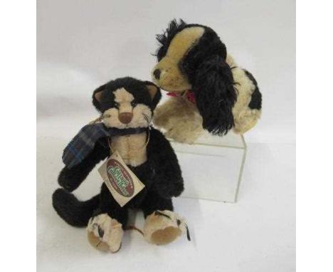 A possible Steiff spaniel dog, with glass eyes and two tone plush, together with a plush cat by Cottage Collectables (2) (Est