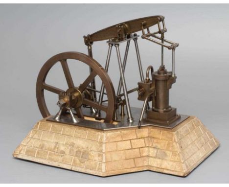 An unusual beam engine model with "A" frame beam support and flywheel bearing support, brass and steel construction of the hi