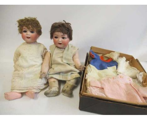 Two Heubach Koppelsdorf bisque socket head dolls, one with blue glass sleeping eyes and trembling tongue, numbered 300 7, the