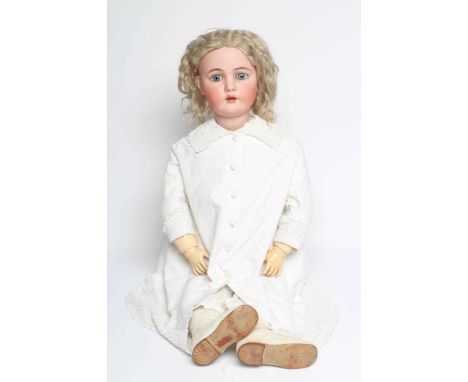 A Kammer &amp; Reinhardt bisque socket head doll, with blue glass sleeping eyes, open mouth, applied teeth, pierced ears, woo
