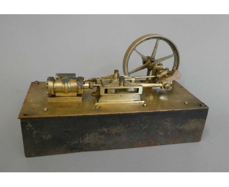 Brass stationary mill type engine on cast iron base marked Made 1890 by C. Baker, Edenbridge, Kent, 9" x 4" x 6" (Est. plus 2