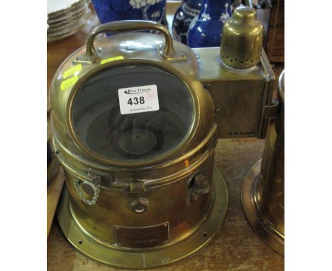 A Nautical brass binnacle cased gimble compass with light box to the side and carrying handle. CONDITION REPORT: Compass - cr