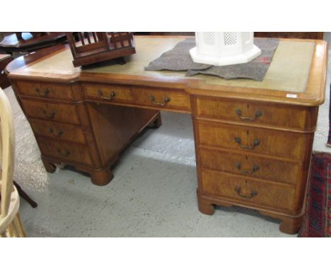 20th Century walnut veneered pedestal desk, on two pedestals of three drawers each, standing on bracket feet. CONDITION REPOR