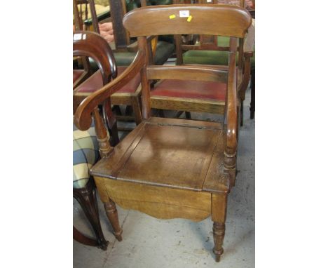 19th Century mahogany bar back commode arm chair.