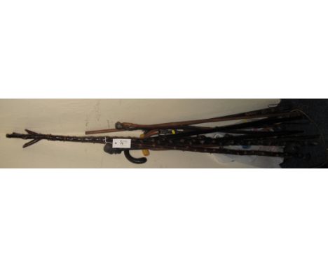 Group of assorted thumb sticks, walking sticks, riding crops, African carved walking stick etc.