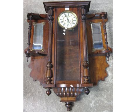 Early 20th Century two train Vienna type wall clock with mirrored wall brackets.