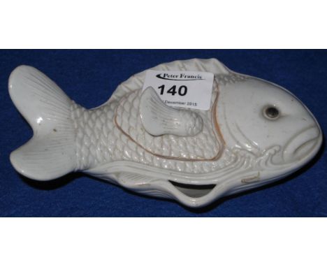 Chinese porcelain lidded water pot moulded in the form of a leaping carp and having small fish shaped finial to the cover.
**