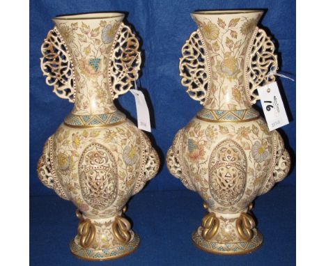 Pair of decorative Czechoslovakian pottery baluster shaped pedestal vases with pierced handles and floral decoration.  Printe
