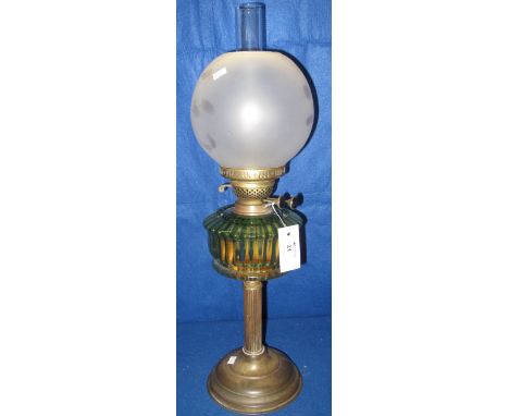 Early 20th Century brass double burner oil lamp with coloured glass fluted reservoir on brass pedestal base.  Frosted glass s