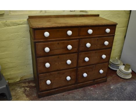 A Victorian pine chest of two rows of four graduated long drawers, with ceramic handles, on plinth base, height 97cm, width 1