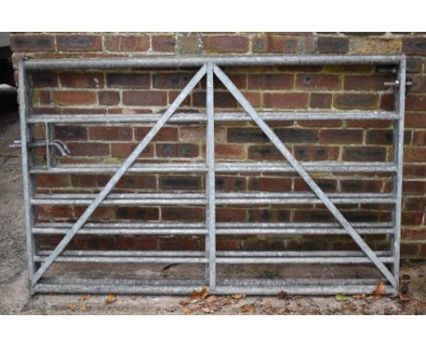 Two five bar farm gates, height 115cm, width 180cm.PROVENANCE: The Raymond Rush Collection. Mr Rush was an engineer, farmer a