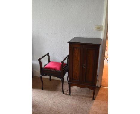 An Edwardian mahogany two door cabinet enclosing a collection of pianola rolls, height 106cm, width 52cm, and an Edwardian ma