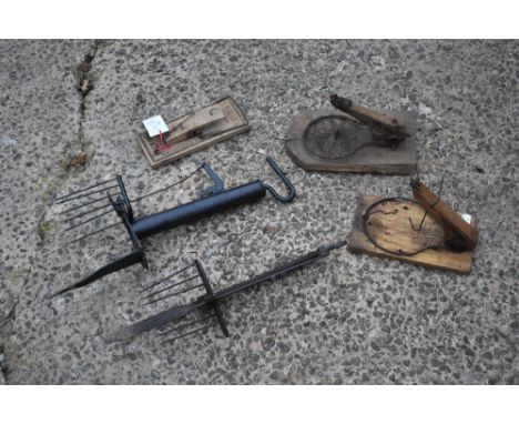 Two vintage wrought iron animal spike traps, longest 47cm, a French Le Merveilleux mousetrap, circa 1920s, (believed to be on