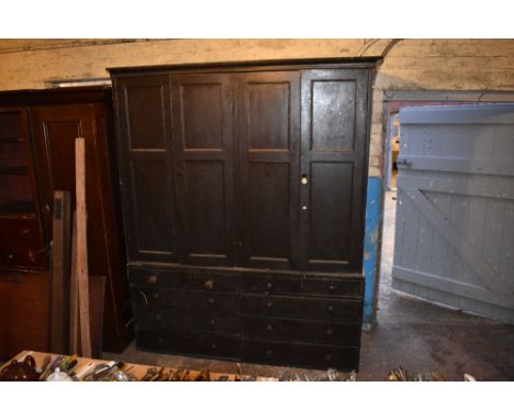 A Victorian painted pine housekeeper's cupboard, with two pairs of panelled doors above four short and six long drawers, heig
