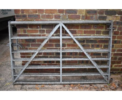 Two five bar farm gates, height 115cm, width 180cm.PROVENANCE: The Raymond Rush Collection. Mr Rush was an engineer, farmer a