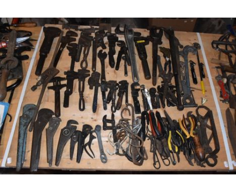 A collection of vintage iron and other metal wrenches and related pliers, various dates, makers and styles.PROVENANCE: The Ra