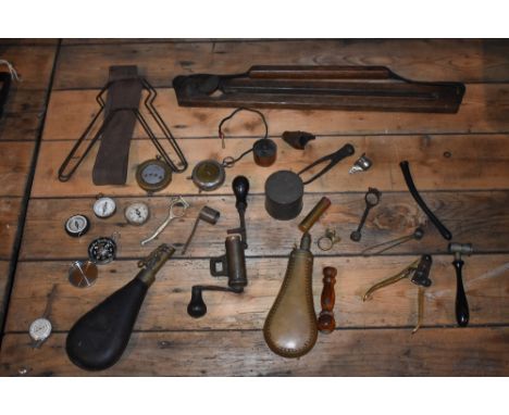 A selection of vintage shooting tools and accessories, including a brass shot flask, various shot makers, also a small assort