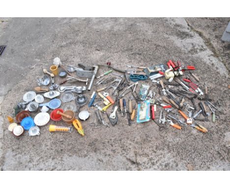 A large collection of vintage to modern can openers and a selection of vintage lemon squeezers (quantity).PROVENANCE: The Ray