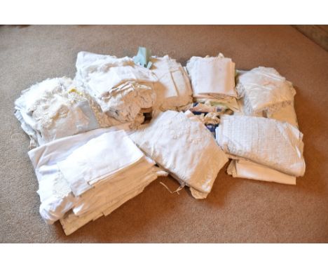 A collection of Edwardian and later white work and lace, including tablecloths, cushions, napkins, etc.PROVENANCE: The Raymon