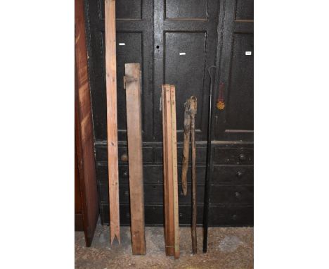 A vintage threshing tool, with a shepherds crook, a plum weight and two treen tools (5).PROVENANCE: The Raymond Rush Collecti