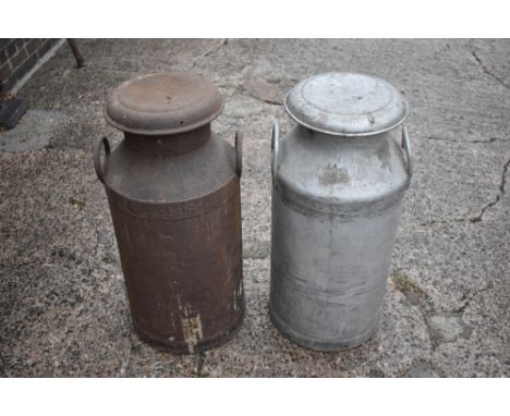 An iron milk churn and cover, an aluminium milk churn and cover, named for Associated Dairies, height 72cm (2).PROVENANCE: Th
